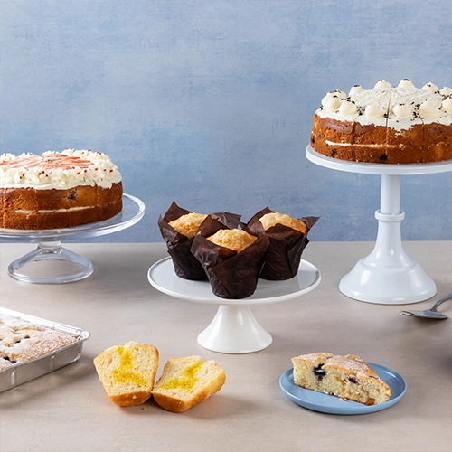 Assorted cakes and muffins on stands