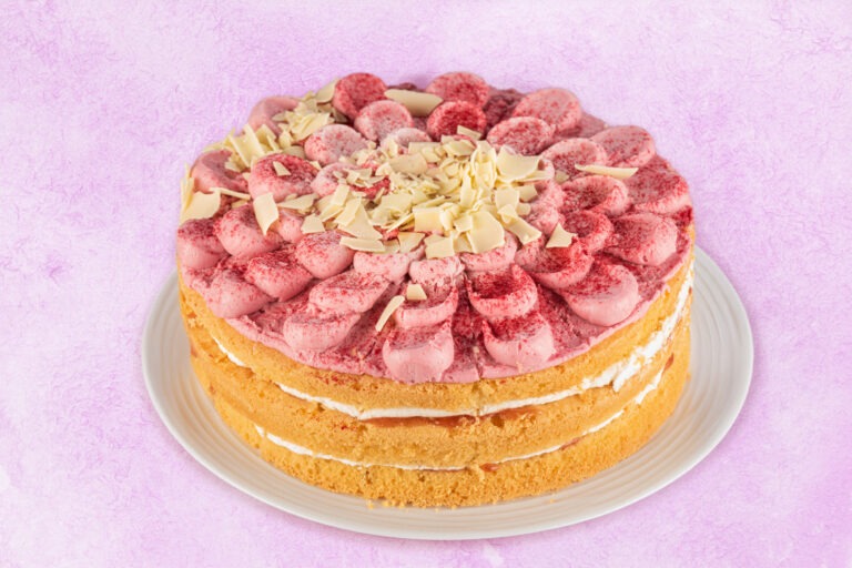 Layered raspberry sponge cake with pink buttercream