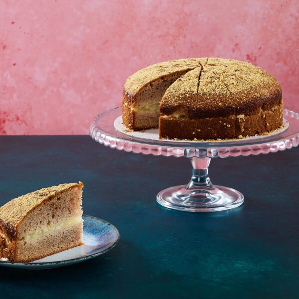 Salted caramel and apple cake with caramel frosting and apple slices.